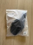 Zwarte SparkNine microfoonriem in plastic verpakking.