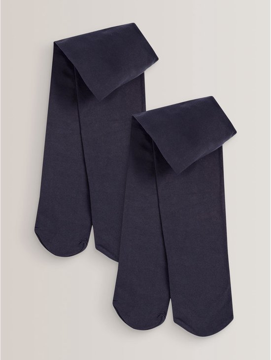 Twee donkerblauwe schoolpanty's van 80 denier, opgevouwen.