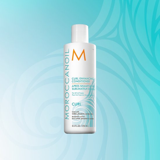 Witte fles met Moroccanoil Curl Enhancing Conditioner (250 ml), met oranje M logo en blauwe krullende lijnen.