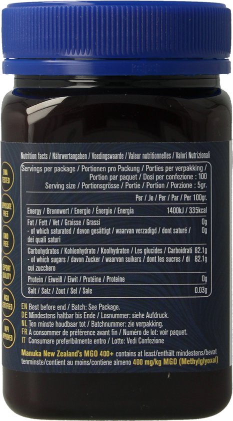 Achterkant pot Manuka Honing met blauw deksel. Voedingsfeiten en productinformatie in meerdere talen.