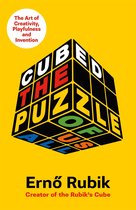 Boek 'Cubed' van Ernő Rubik, over 'The Art of Creativity, Playfulness and Invention'. Cover is geel met een 3D-afbeelding van een Rubik's Cube.