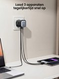 Joyroom GaN-oplader laadt tegelijkertijd een laptop, iPhone en tablet op.