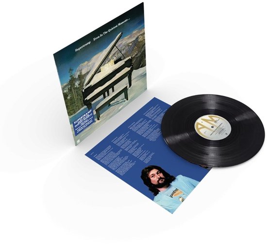 Zwarte vinyl LP van Supertramp met een vleugelpiano bedekt met sneeuw in een berglandschap. Bevat ook een inzetstuk met tekst en een foto van een man met lange haren.