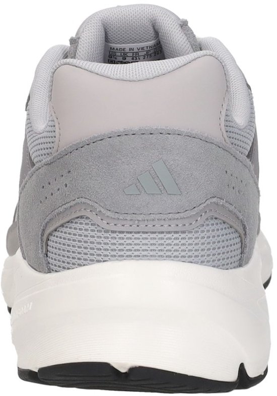 Achterkant van een grijze Adidas sneaker met witte zool en Adidas logo.