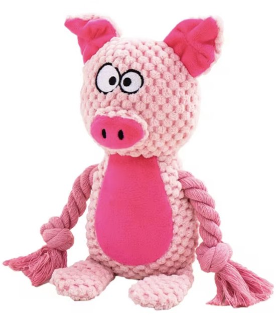 Zittend roze, gebreid varkensspeeltje met touwen en grote ogen.