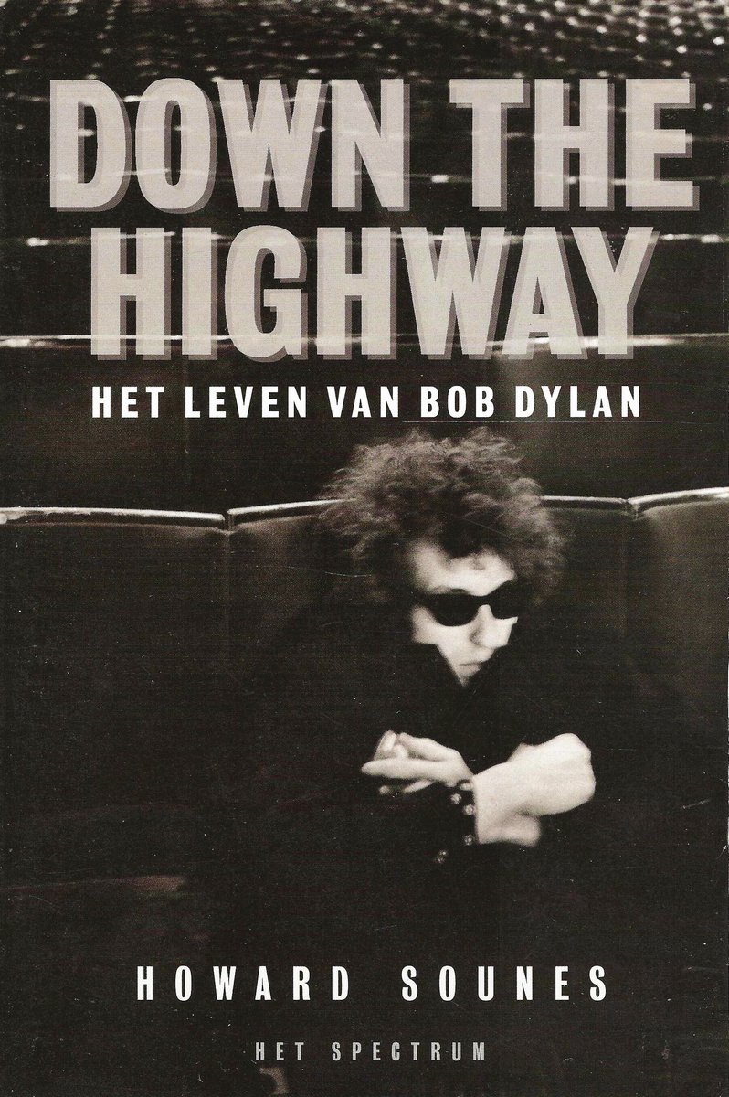 Boekomslag van 'Down the Highway - Het Leven van Bob Dylan' met een zwart-witfoto van Bob Dylan met zonnebril.