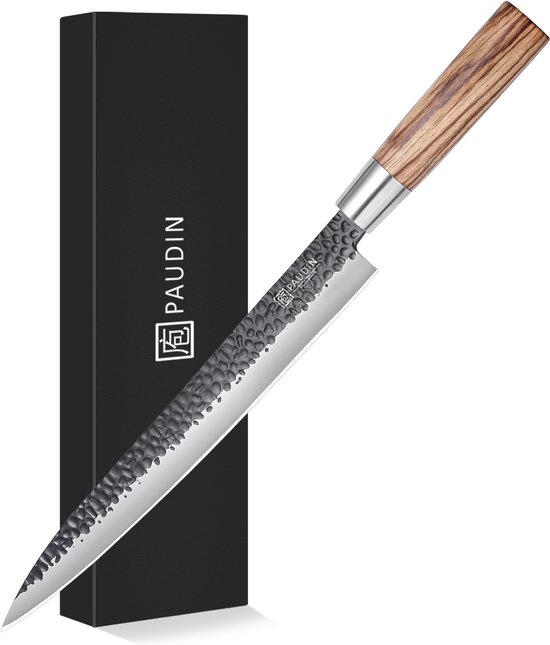 PAUDIN Japans mes met gehamerd lemmet en zebranohouten handvat, naast de zwarte verpakking.
