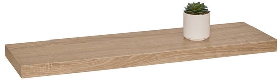 Drijvende plank van eikenhout met een kleine plant erop.