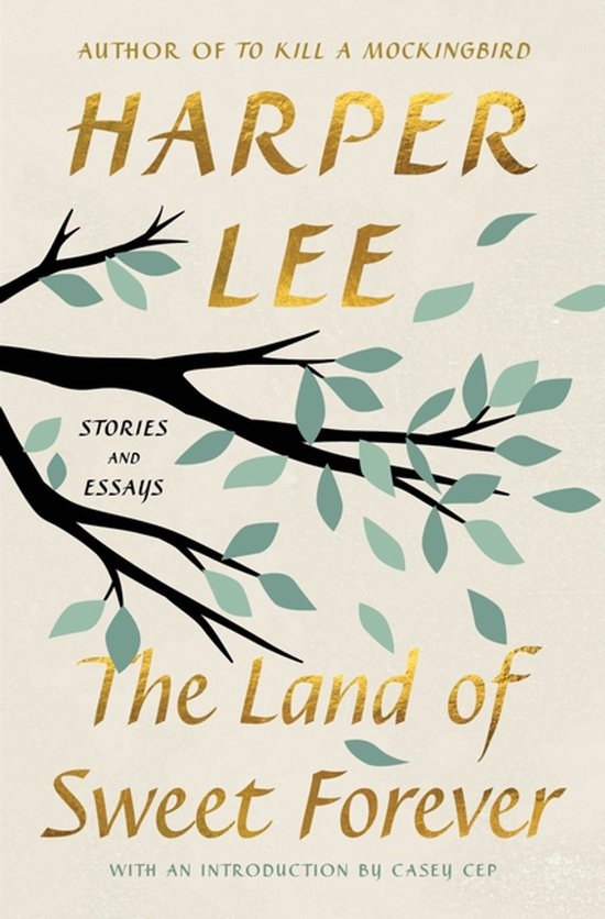 Livre "The Land of Sweet Forever" de Harper Lee, avec des lettres dorées, une branche avec des feuilles vertes et un fond beige.