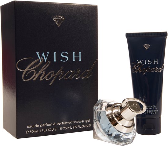 Donkerblauwe Chopard Wish cadeauverpakking met parfumfles en douchegel.