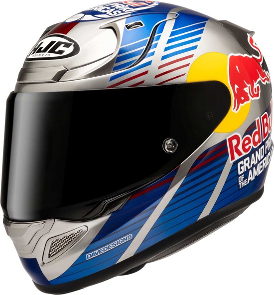 Zilveren helm met Red Bull logo, 'Grand Prix of the Americas' tekst, blauwe en rode strepen, en 'Davedesigns' tekst.