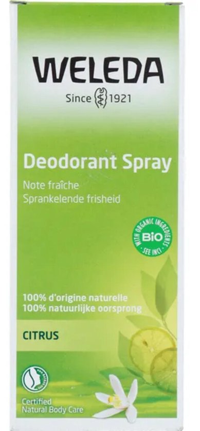 Groene Weleda Citrus Deodorant Spray kartonnen verpakking met citroenen en een bloem.