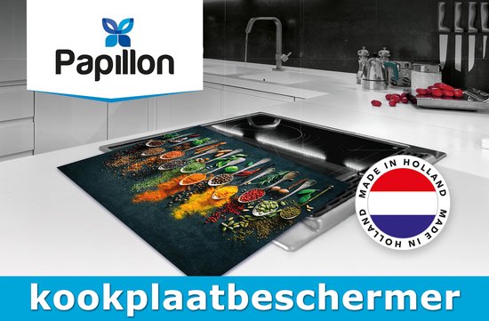 Protège-plaque de cuisson avec imprimé d'épices, placé sur une plaque à induction. Fabriqué en Hollande.