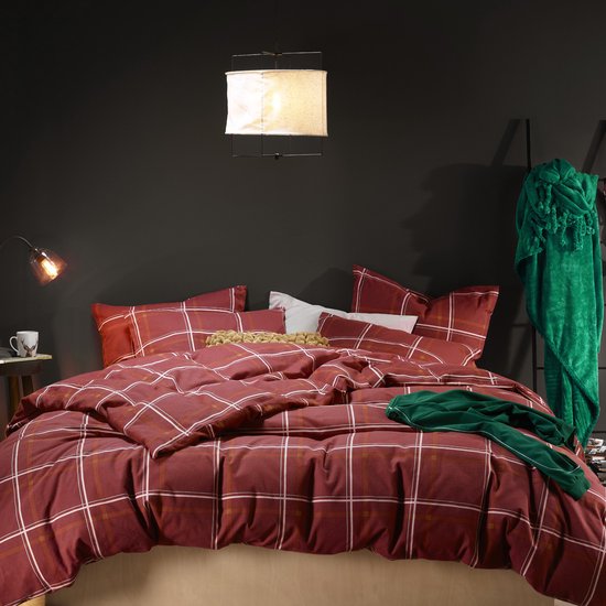 Housse de couette rouge à carreaux blancs et jaunes, avec deux taies d'oreiller.