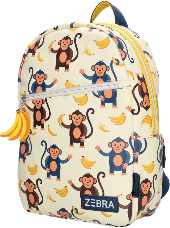 Sac à dos crème imprimé de joyeux singes bleus et bruns et de bananes, avec fermeture éclair et poignée jaunes.