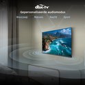 CHiQ TV met een kustlandschap op het scherm en geluidsgolven die "dbx-tv" en audiomodussen aangeven.