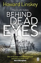 Boekcover van "Behind Dead Eyes" met een foto van een somber landschap, prikkeldraad en een klein huisje.