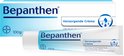 Doos en tube Bepanthen Verzorgende Crème, 100g, wit met blauwe opdruk.