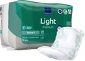 Verpakking Abena Light Premium Extra inlegkruisjes, met een los inlegkruisje met groen bloemenpatroon.