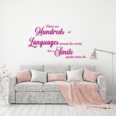 Muursticker There Are Hundreds Of Languages Around The World But A Smile -  Roze -  80 x 46 cm  -  alle muurstickers  woonkamer  engelse teksten - Muursticker4Sale