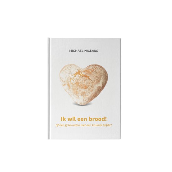 Boekcover met een hartvormig brood en tekst 'MICHAEL NICLAUS Ik wil een brood! Of ben jij tevreden met een kruimel liefde?'
