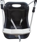 Siège de balançoire noir pour bébé avec pare-chocs beige et harnais de sécurité gris, sur corde blanche.