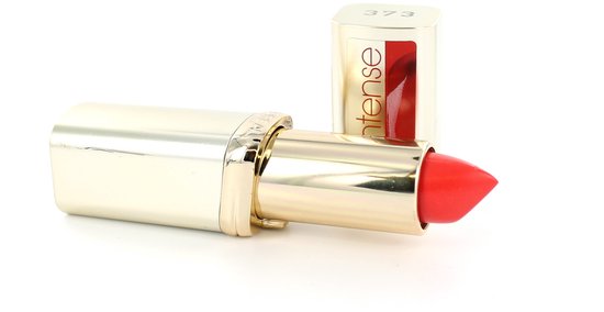 Koraalkleurige L'Oréal lipstick, nummer 373, met gouden huls en dop.