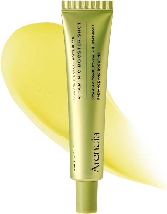 Lichtgroene tube Arencia Vitamin C Booster Shot voor gezicht en ogen met een veeg gele crème erachter.