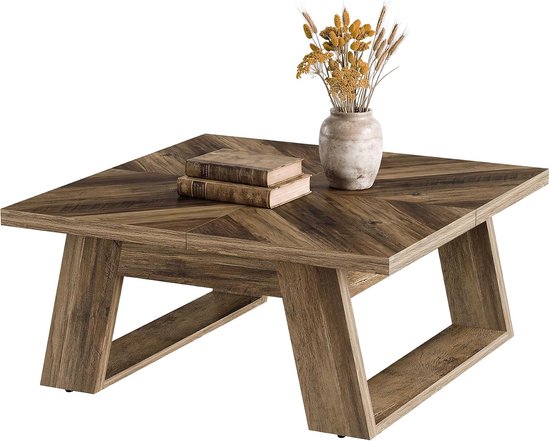 Vierkante salontafel met een houten blad in visgraatpatroon en stevige U-vormige poten, met een vaas met droogbloemen en twee boeken erop.