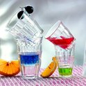 Verres Duralex Picardie empilés avec différentes boissons colorées. Servi avec des quartiers d'orange.