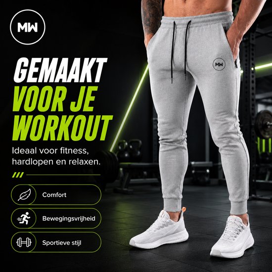 Grijze trainingsbroek met MW logo, ritszakken en trekkoord. "Gemaakt voor je workout". Ideaal voor fitness, hardlopen en relaxen. Comfort, bewegingsvrijheid, sportieve stijl.