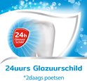 Tand met een rood schild met '24h Glazuur Schild+'. "24uurs Glazuurschild*".
