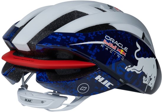 Wit fietshelm met blauwe zijkanten, rode stier en Red Bull Racing logo's. Rode voering zichtbaar.