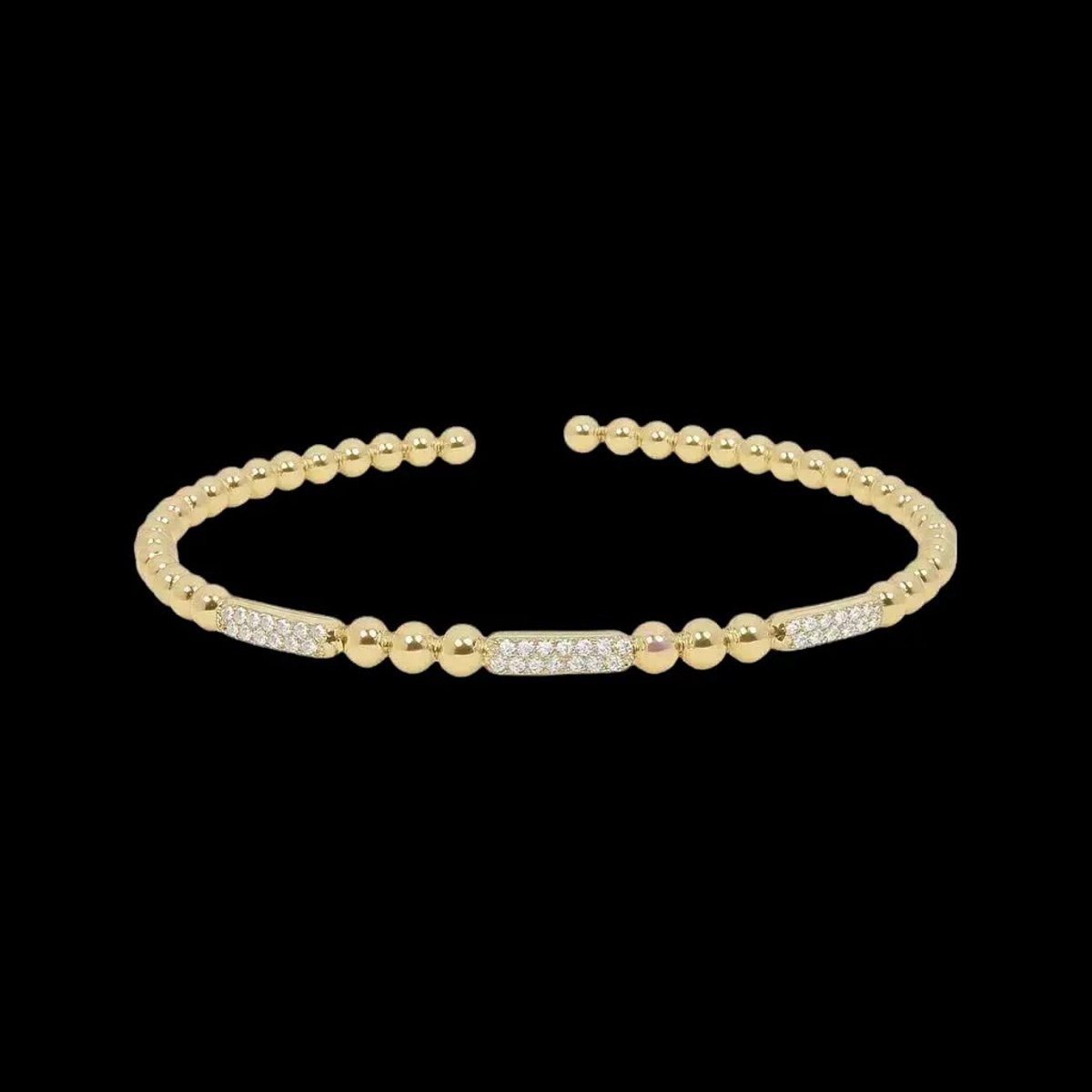 Victoria Valenza Goudkleurige Bolletjes Flexarmband met Zirkonia Stenen - Armband - Goudkleurig - Zirkonia