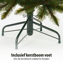 Een groene kerstboomvoet met de tekst 'Inclusief kerstboom voet'.