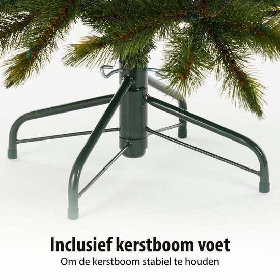 Een groene kerstboomvoet met de tekst 'Inclusief kerstboom voet'.