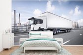 Behang - Fotobehang Witte vrachtwagen op de snelweg - Breedte 375 cm x hoogte 280 cm