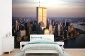 Behang - Fotobehang Luchtfoto van Manhattan's World Trade Center boven de Hudson rivier in New York - Breedte 390 cm x hoogte 260 cm