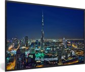 Fotolijst incl. Poster - Dubai en de Burj Khalifa verlicht in de avond - 60x40 cm - Posterlijst