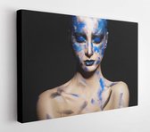 Canvas schilderij - Girl in blue paint on his face  -     386836999 - 115*75 Horizontal