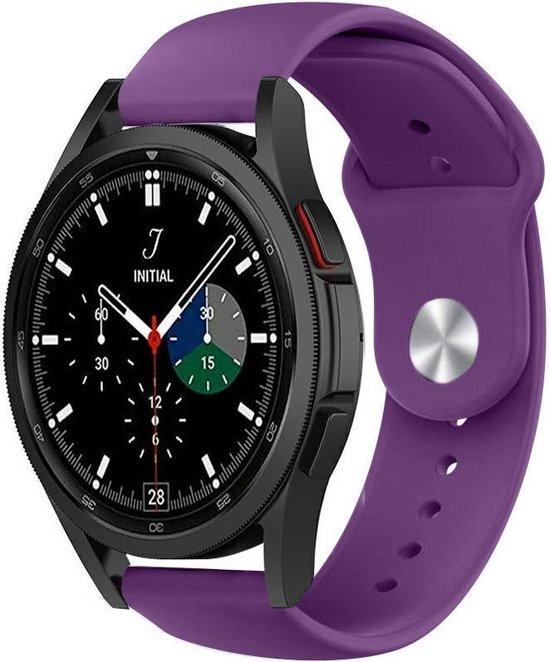 Bracelet de sport violet en silicone, attaché à une Samsung Galaxy Watch 4 Classic noire avec un cadran noir.