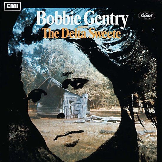 Albumhoes: Close-up van Bobbie Gentry's gezicht met EMI-logo, met een rustiek huisje en bomen op de achtergrond.