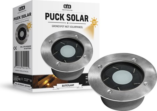 Verpakking en grondspot van KS Verlichting Puck Solar. De grondspot is rond met een metalen rand en glazen zonnepaneel.