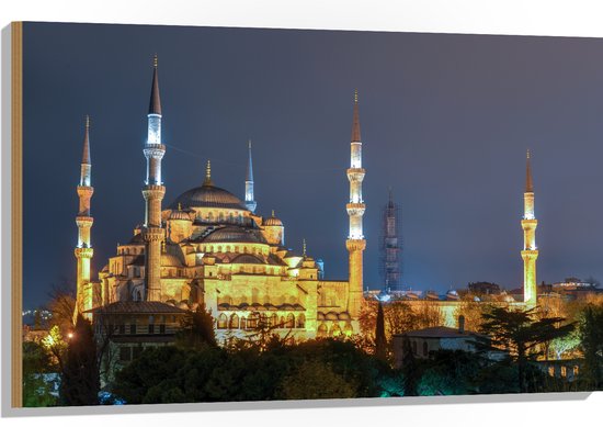 WallClassics - Hout - Sultan AhmetMoskee in de Nacht in Istanbul, Turkije - 105x70 cm - 9 mm dik - Foto op Hout (Met Ophangsysteem)