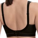 Zwarte sportbeha met haakjessluiting aan de achterkant en geperforeerd mesh materiaal.
