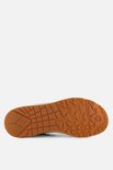 Semelle intérieure de basket Skechers beige avec un profil brun adhérent.