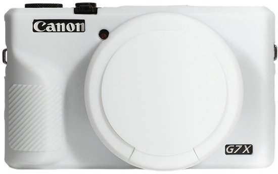 Witte Canon G7X camera met een cirkelvormige lenskap en geribbelde grip.