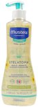 Mustela Stelatopia Cleansing Oil, 500 ml fles met pompje, met zonbloem-motief.