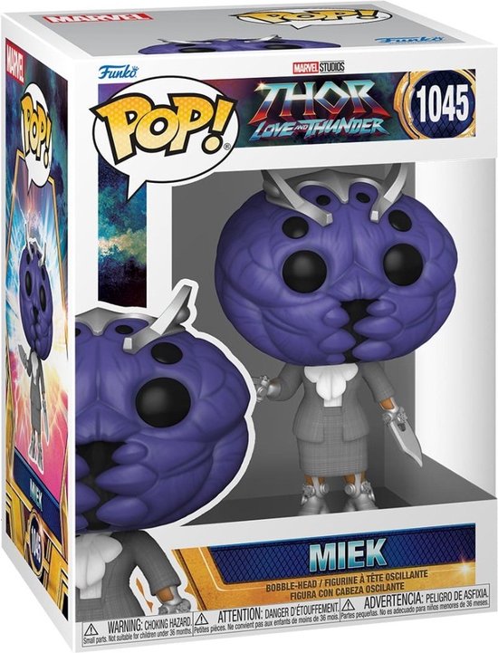 Funko Pop! Miek figuur in doos, met paars hoofd, grijze outfit en zilveren schoenen.