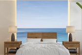 Behang - Fotobehang De Caraïbische Oceaan vanuit een oneindig zwembad - Breedte 260 cm x hoogte 260 cm